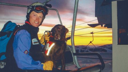 Sun Valley ski patroller Troy Quesnel and his late chocolate Lab, Kintla.